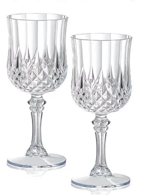 Clear glass goblets arranged for formal event table settings