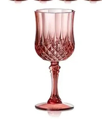 Pink glass goblets arranged for formal event table settings